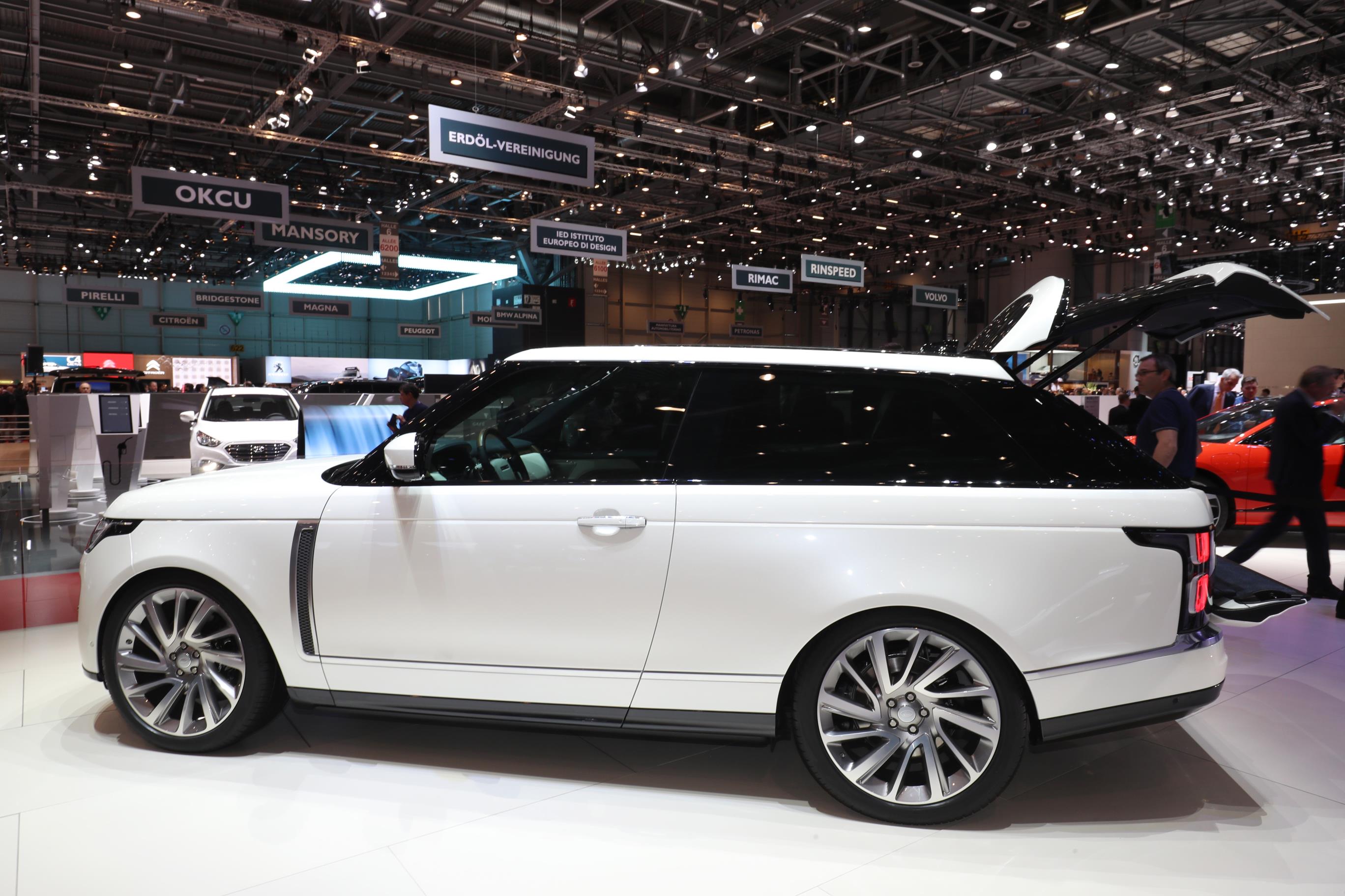 White Range Rover SV coupe at a motor show seen side on